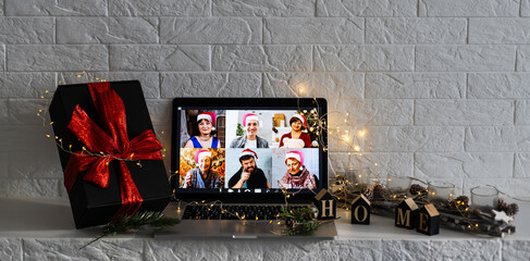 Christmas day Virtual meeting team teleworking. Family video call remote conference. Laptop webcam screen view. Diverse portrait headshots meet working from their home offices. Happy hour party online