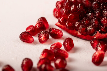 pomegranate, pomegranate seeds are scattered on a white background