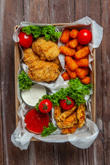 Business lunch in paper container ready for delivery. Top view. Office Lunch boxes with food ready to go. Food takes away. 