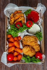 Business lunch in paper container ready for delivery. Top view. Office Lunch boxes with food ready to go. Food takes away. 