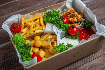 Business lunch in paper container ready for delivery. Top view. Office Lunch boxes with food ready to go. Food takes away. 