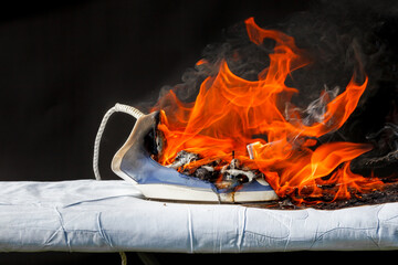 Iron on ironing board in flames fire,  cause of fire