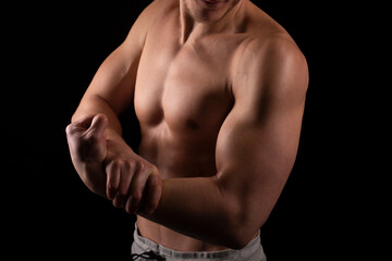 Man Showing Biceps Hands Up. Sportsman Showing Muscles. ABS, Biceps Muscles. Black Background. Topless Man Hand Close Up