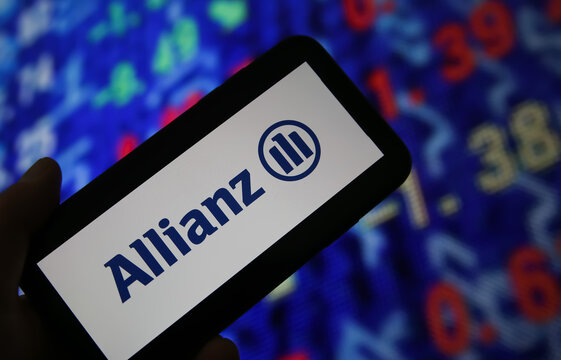 Viersen, Germany - June 6. 2021: Closeup of mobile phone screen with logo lettering of allianz insurance, stock market chart background