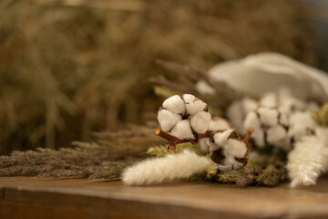 Bouquet of dried flowers on a hay background