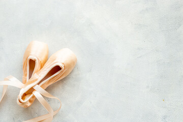 Pastel beige ballet pointe shoes or slippers with ribbon - obrazy, fototapety, plakaty