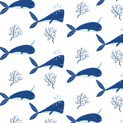 Childrens seamless pattern with blue whales. Patter with cute whale and narwhal. Suitable for fabrics, wrapping papers and prints.