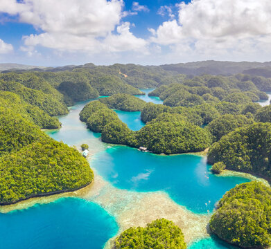 Aerial shot a Limestone islands form a remote lagoon in northern Raja Ampat, Indonesia. Hi Res panorama.
