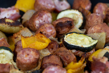 Sausages, peppers, onion and zucchini from the shashlik