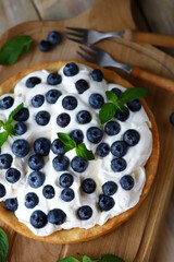 Delicious tart with cream cheese and blueberries.