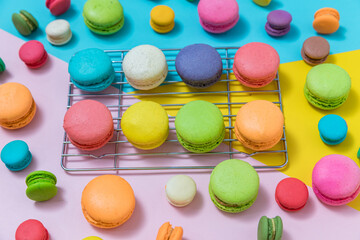 Colorful macaroons variety. colorful macarons dessert with vintage pastel tone. Sweet colorful macaroons on color background