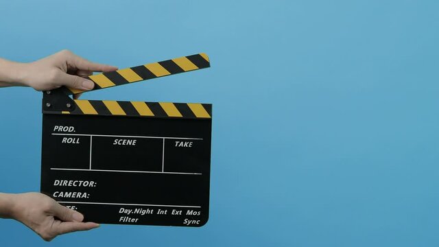 Movie Clapper Board. Hollywood Director Film Slate. Film crew hold and clapping film slate in video recording. Using for cut action or visual effects and scene prop. Clapperboard of movie production.