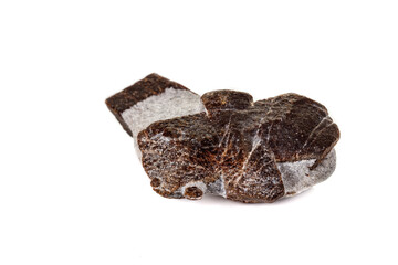 macro mineral stone Staurolite on a white background