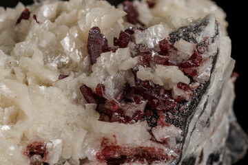 Macro stone Cinnabar dolomite mineral on a black background