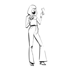 Blonde woman waving an instant photo after taking a polaroid picture