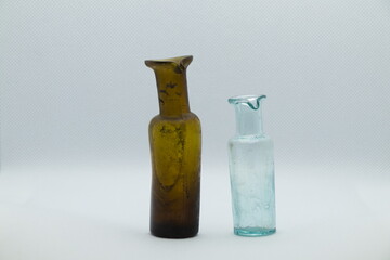 Two old brown and white pharmacy bottles