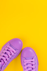 Ultra Violet sneakers on yellow background. Concept of healthy lifestile and food, everyday training and force of will.