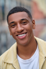 Fototapeta premium Headshot of a smiling handsome young man