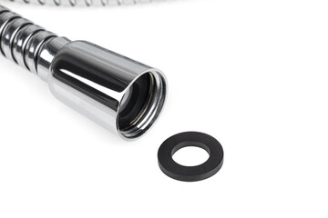 Shower hose on a white background. Silver shower hose close-up.