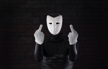 funny mime in a white mask on a black background