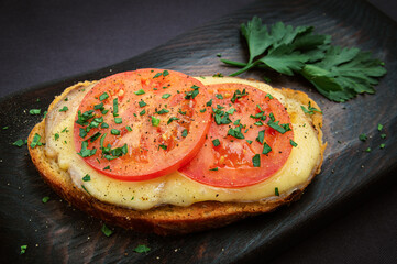 hot open sandwich with cheese, tomato and ham