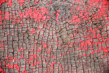 Red peeling paint texture on an old wooden board