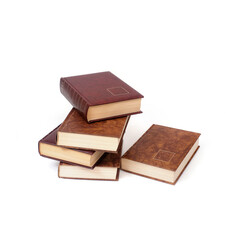 Stack of books in brown covers isolated on a white background