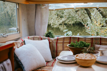 cozy kitchen interior in the trailer of mobile home or recreational vehicle, concept of family...