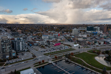 sunset fall Drone view of Barrie waterfront downtown with blue skies and clouds  centennial park and lakeshore drive  road with fall colours  