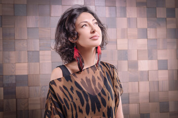 Portrait of an adult Asian woman with a dreaming look.