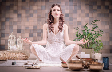 Image of an adult woman in yoga place. Meditation. The concept of yoga and spiritual practices.