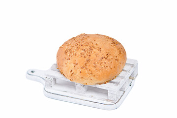 Wooden pallet with burger bun on white background