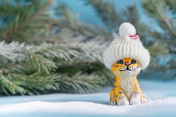 Figures of tigers in caps on a blue background