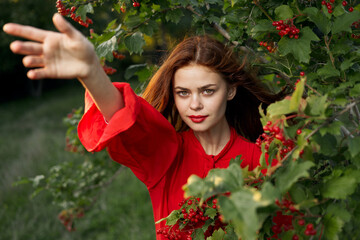 pretty woman in red shirt bush nature freedom