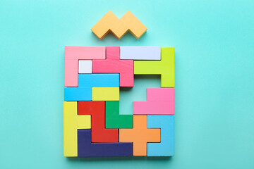 Obraz premium Multicolored puzzle and cubes on a blue background