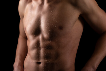 Fototapeta na wymiar Man Showing ABS. Muscle man Posing. Strong Body Concept. Topless Sportman Bodybuilder. Six Pack