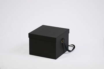 Black empty template square gift cardboard packaging box with closed lid