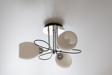 Ceiling lamp with white shades.