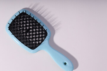 Bright hair brush an white background. 