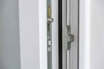 The lock mechanism on the plastic door. Lubrication of mechanisms and hinges of plastic doors and windows.