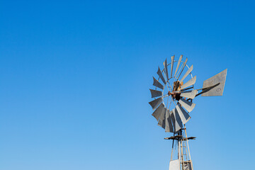 windmill against the blue sky in clear weather. copy space.