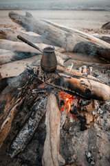 black turkish coffee cooking on the fire