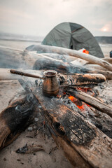 black turkish coffee cooking on the fire