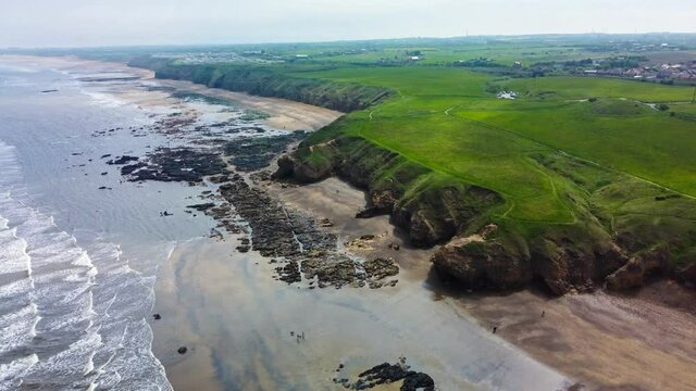 Cliffs and beach at Blackhall Rocks and Cromdon Dene Beach