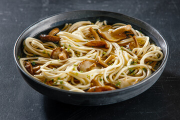 Asian noodles with mushrooms in bowl