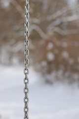 Fototapeta na wymiar Metal chain in cold winter