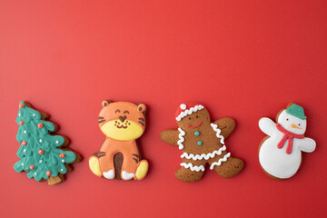 Set of traditional Christmas gingerbread on bright red background party banner. Copy space.