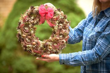 Handmade wreath from natural fir branches for decoration on and winter holidays. Christmas