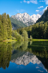 Scenic mountain reflection in the lake Plansansko jezero at Jezersko, Slovenia
