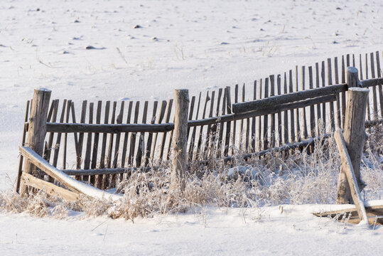 Old Fence In The Village, It Is Snowing.